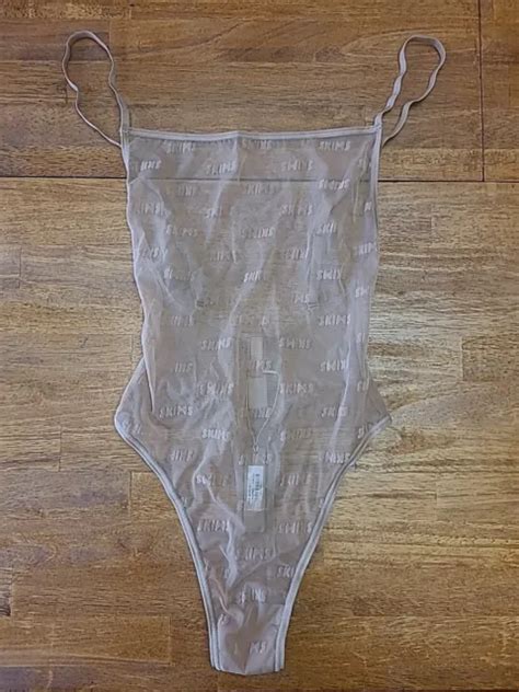 Wear this sexy plunge neck thong bodysuit alone with your favorite bottoms or under dresses to accentuate your curves and snatch your silhouette. Features unlined cups to flatter your bust, adjustable back straps that you can wear cross back, and a bottom gusset with snap closure. Fits true to size. Size down for more compression. 